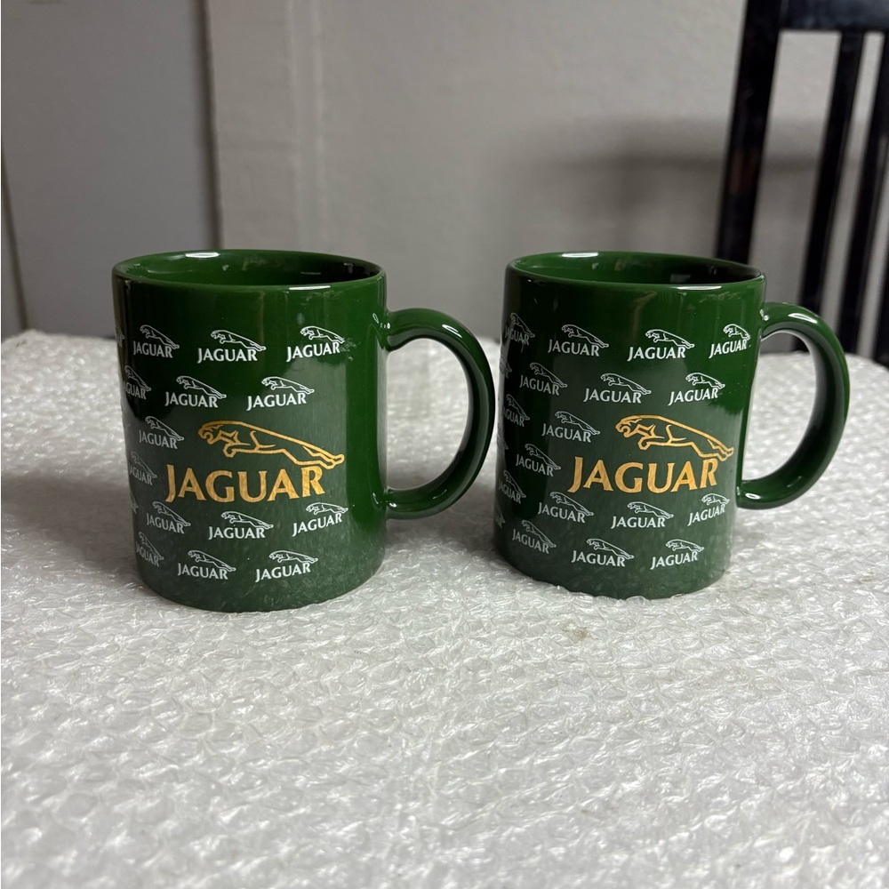 Jaguar-branded coffee mug with a gold Jaguar logo